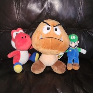 Lot of 3 Nintendo Super Mario Plush Toys. 10" Goomba, 7" Luigi, 8" Red Yoshi